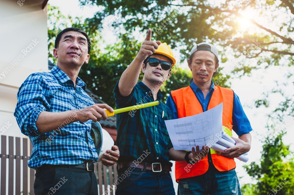 The construction project inspector team visits the site to inspect the ...
