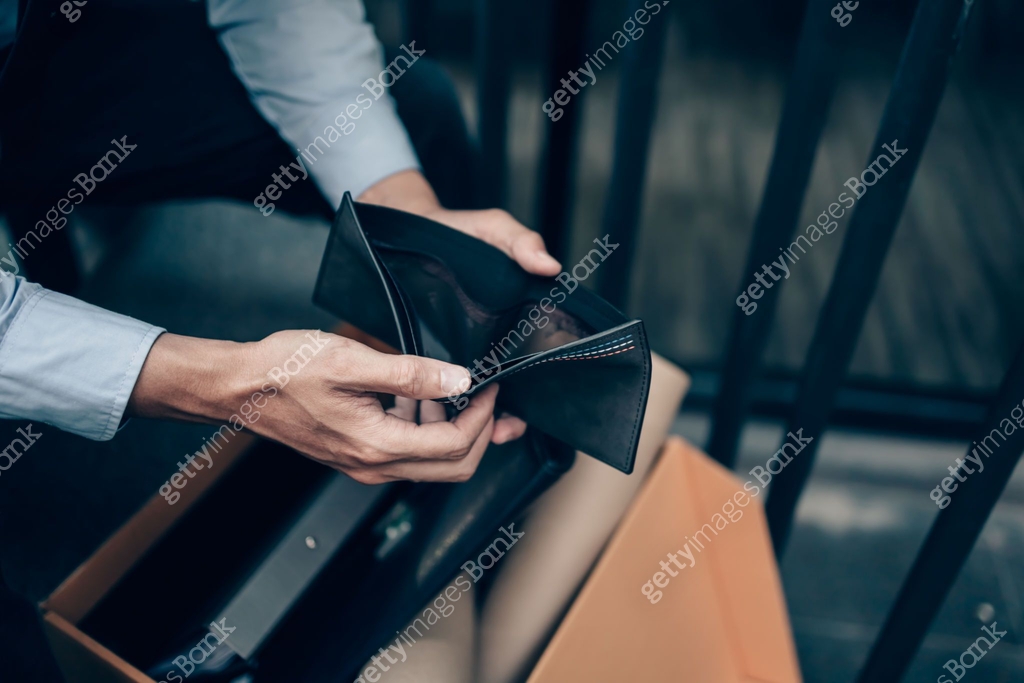 Office worker lost his job and open a wallet without money. Man empty ...