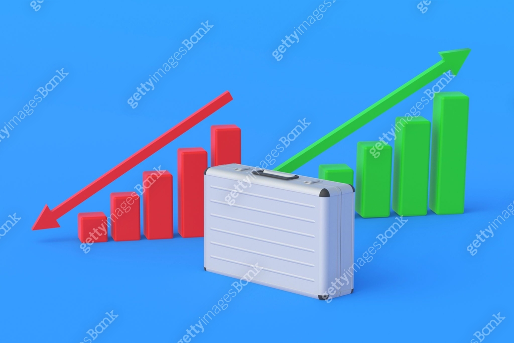 Suitcases near charts with up, down arrow. Forecasting profitability of ...