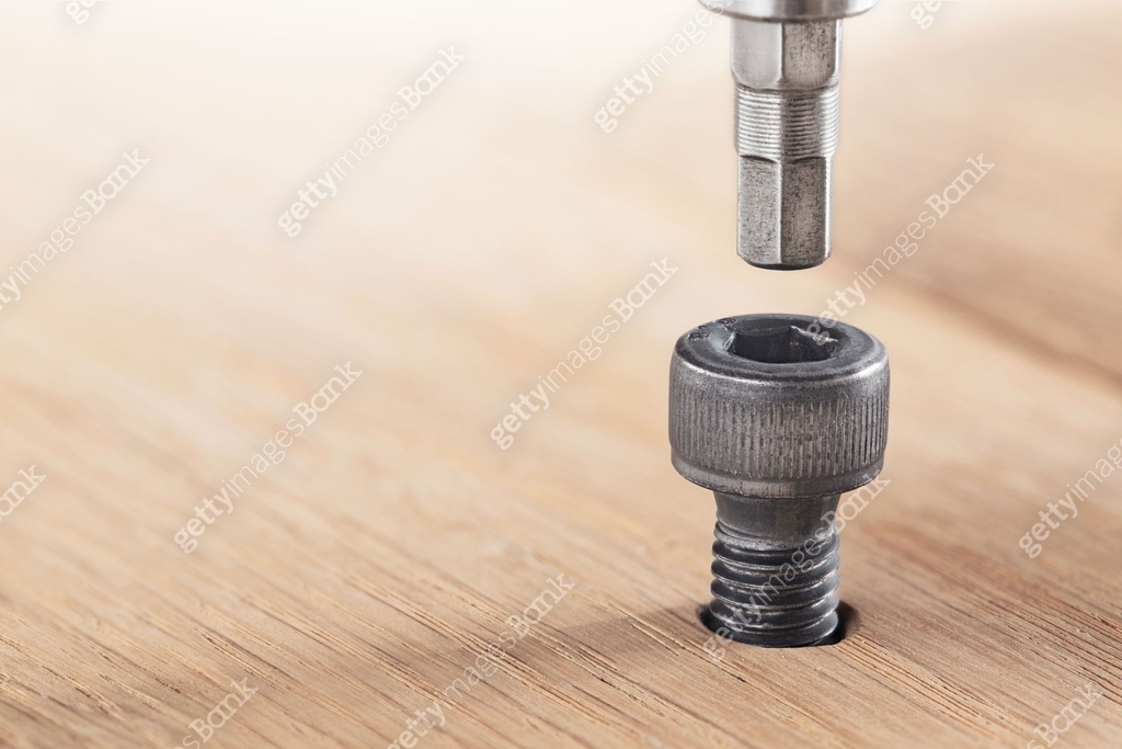 hex bolt screw hex bit in wooden oaks plate. Spanner, bolt, screw and ...