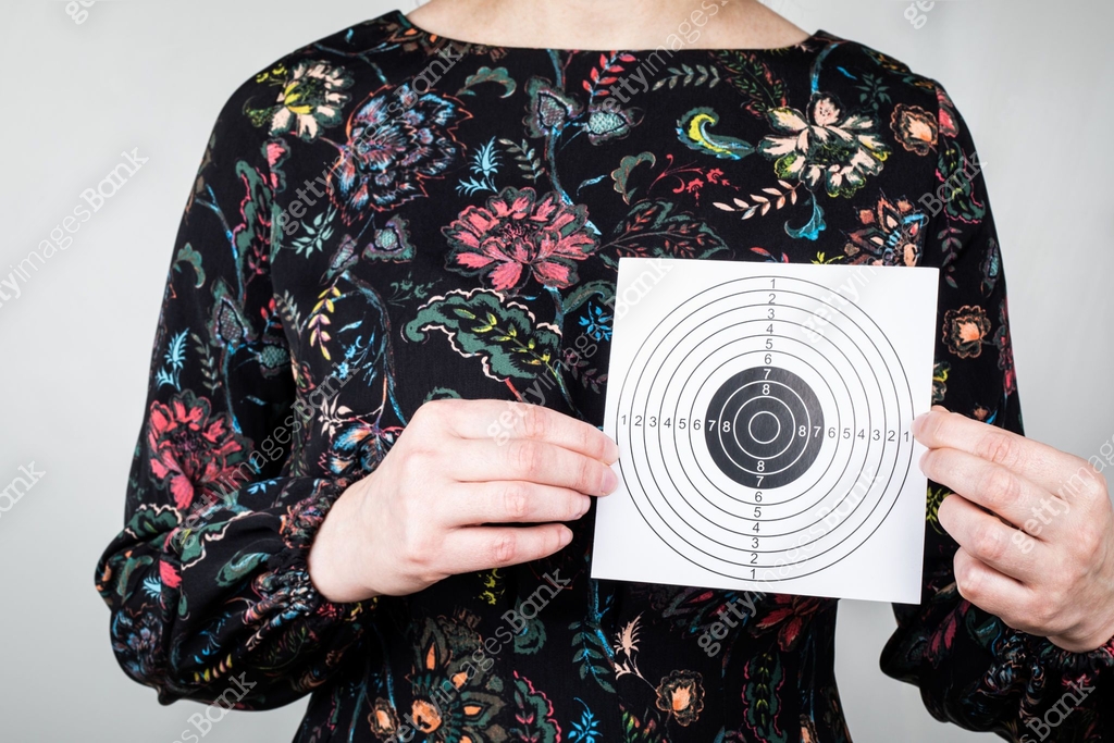Hand Shape Target Paper target in woman hands. Symbolizes achievement, health or future ...