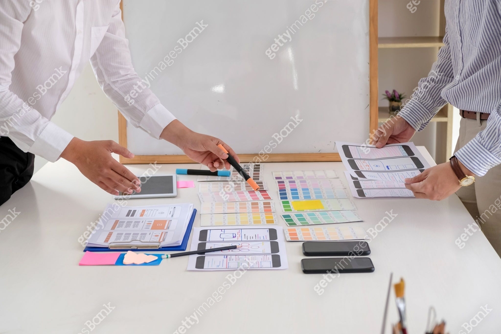 Close-up of a group of business people designing create and develop UX ...