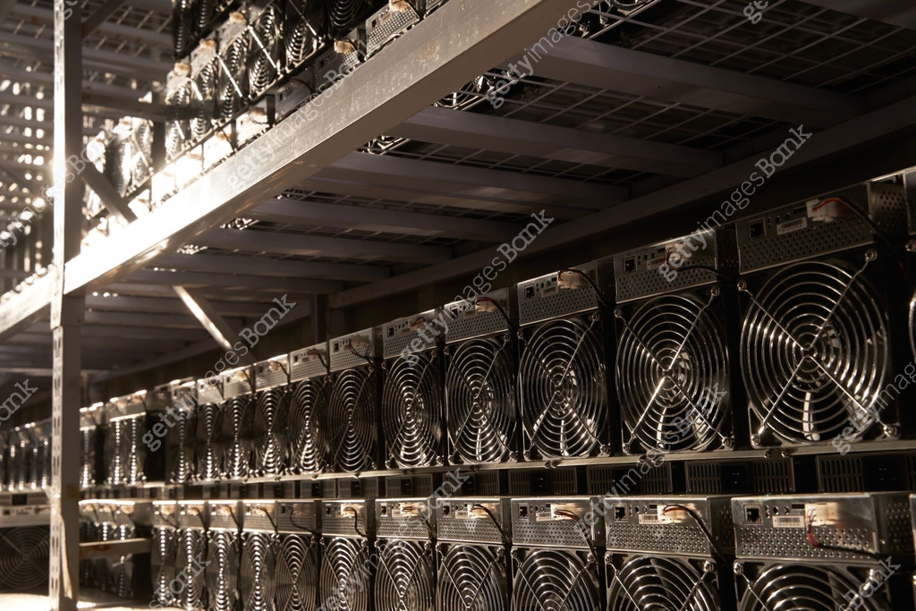 Bitcoin ASIC miners in warehouse. ASIC mining equipment on stand racks ...