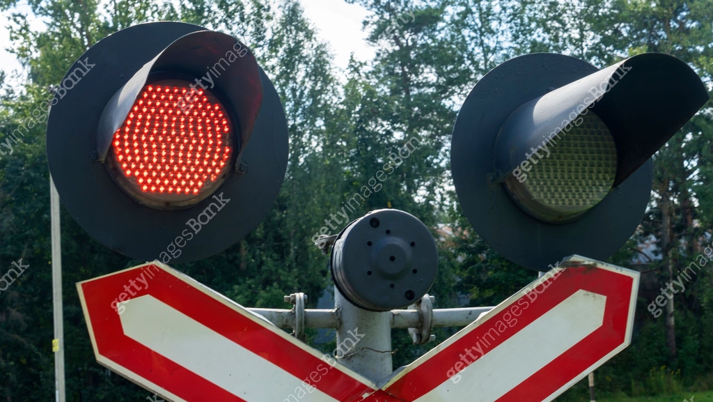 Rail Sign Lighting Road sign of railway crossing with double traffic light, shining red ...