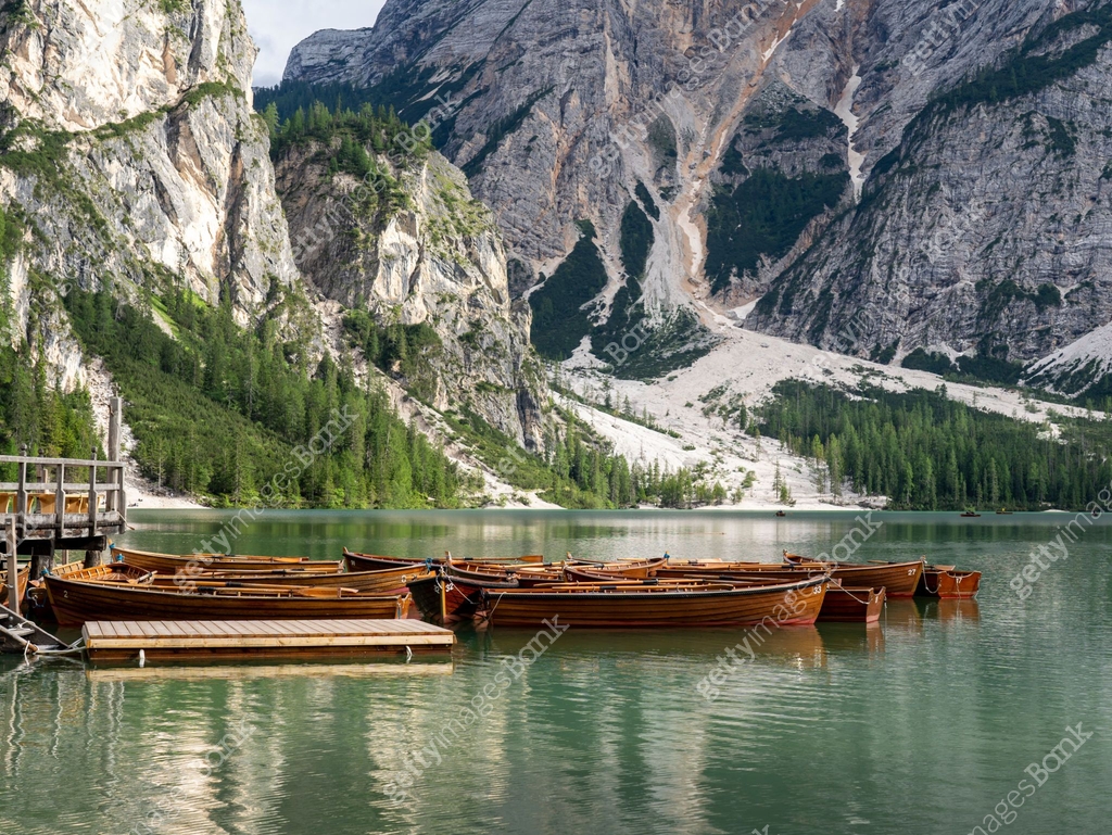 Alpine Lake Rowing Braies Lake, Italy. Group of the traditional rowing boats made of wood ...
