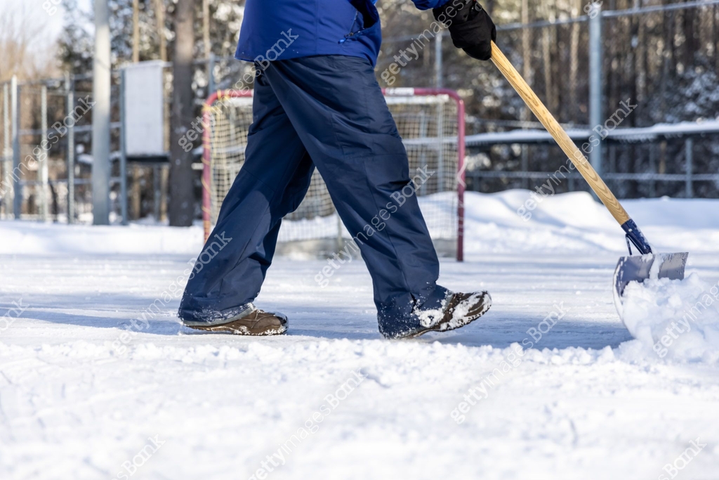 Man Shovelling Snow on Outdoor Ice Rink Before Hockey Game 이미지 ...