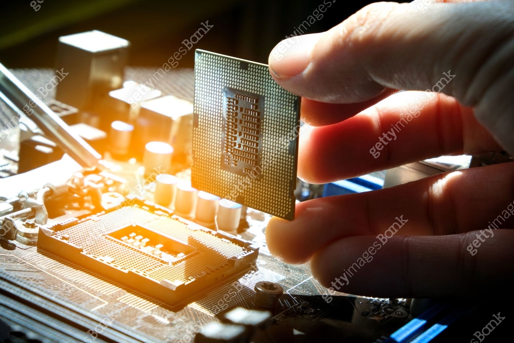Getty Images Computer Processing Hand of computer engineering brings computer cpu processor memory ...