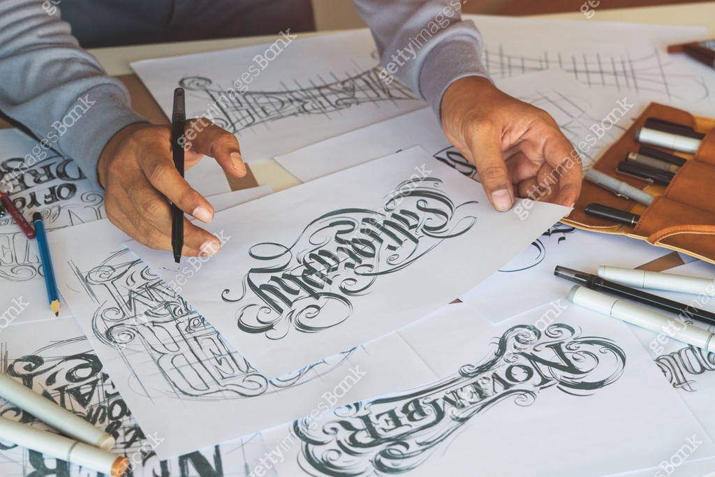 Typography Paper Drawing Typography Calligraphy artist designer drawing sketch writes letting ...