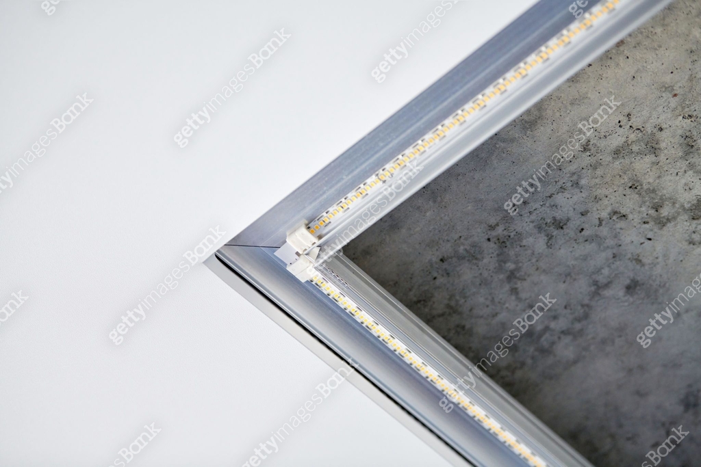 Strip LED light with square aluminum profile on stretch ceiling close
