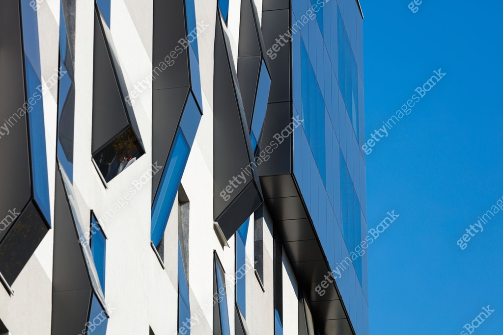 Modern building facade segment in concrete and uneven protruding ...