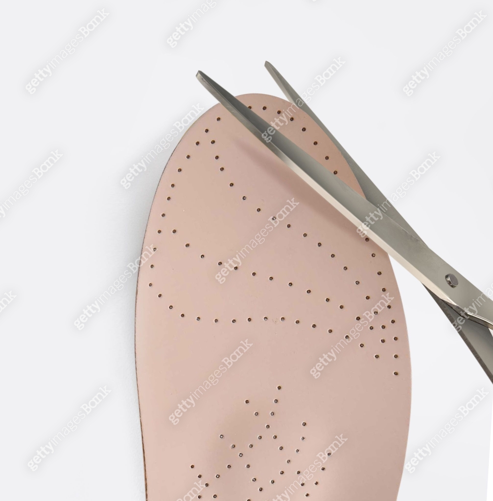 Root Foot Insole Orthopedic insole on a white background. Treatment and prevention of ...
