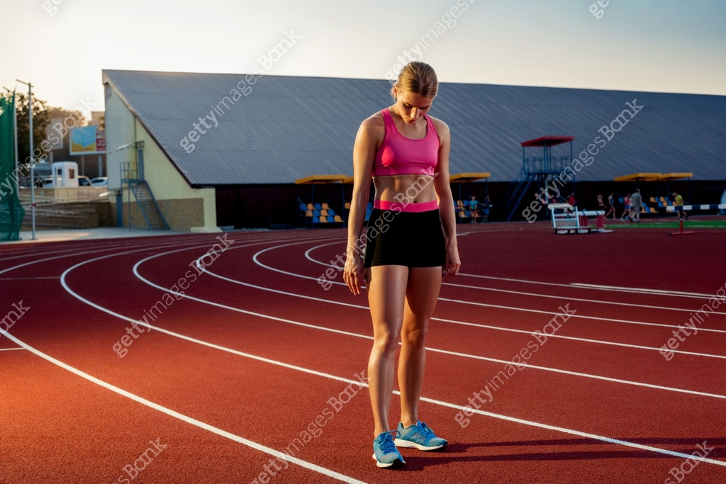 Runner sprinting towards success on run path running athletic track ...