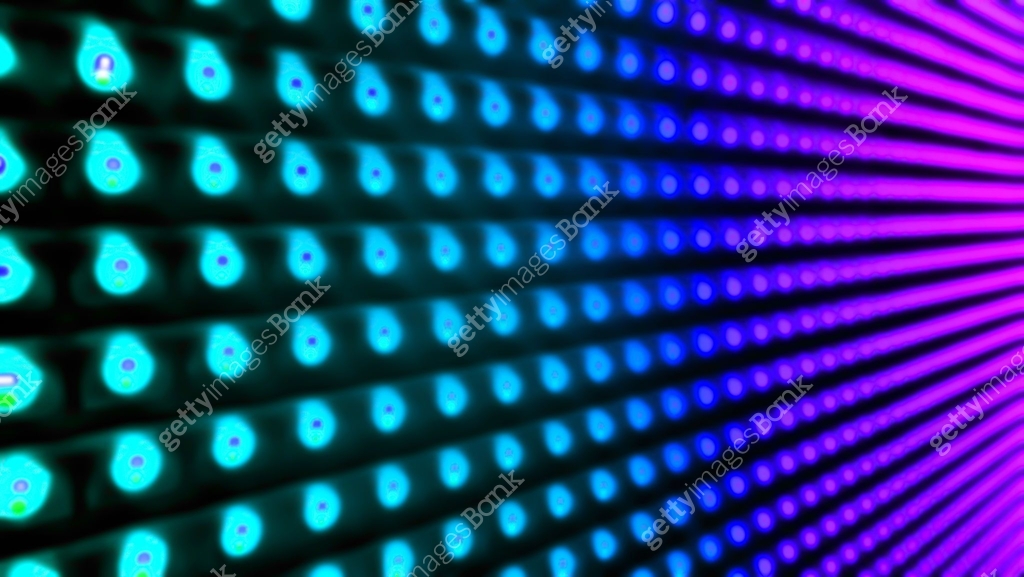 blurred view of abstract bulb lights in blue, cyan, purple color. close ...