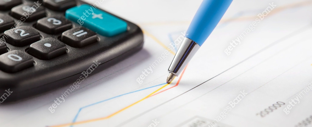 Accounting document with pen,color diagram and checking financial chart ...