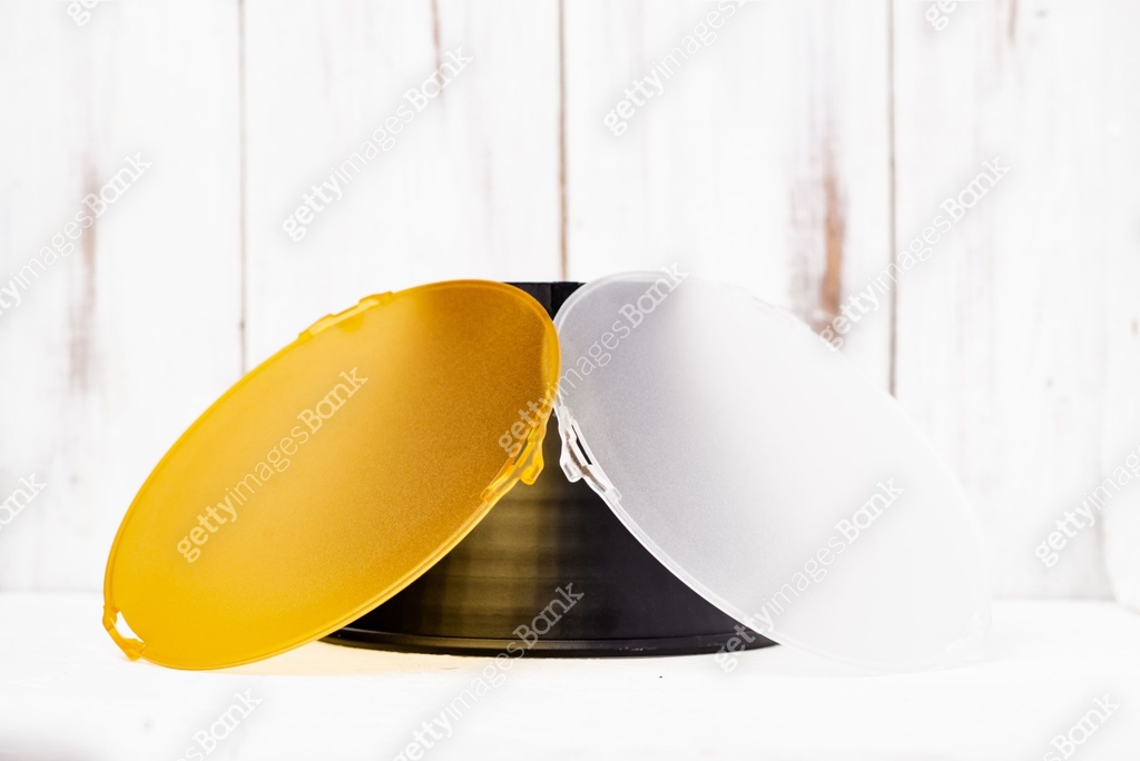 Standard reflector with matt white and yellow diffuser on a white ...