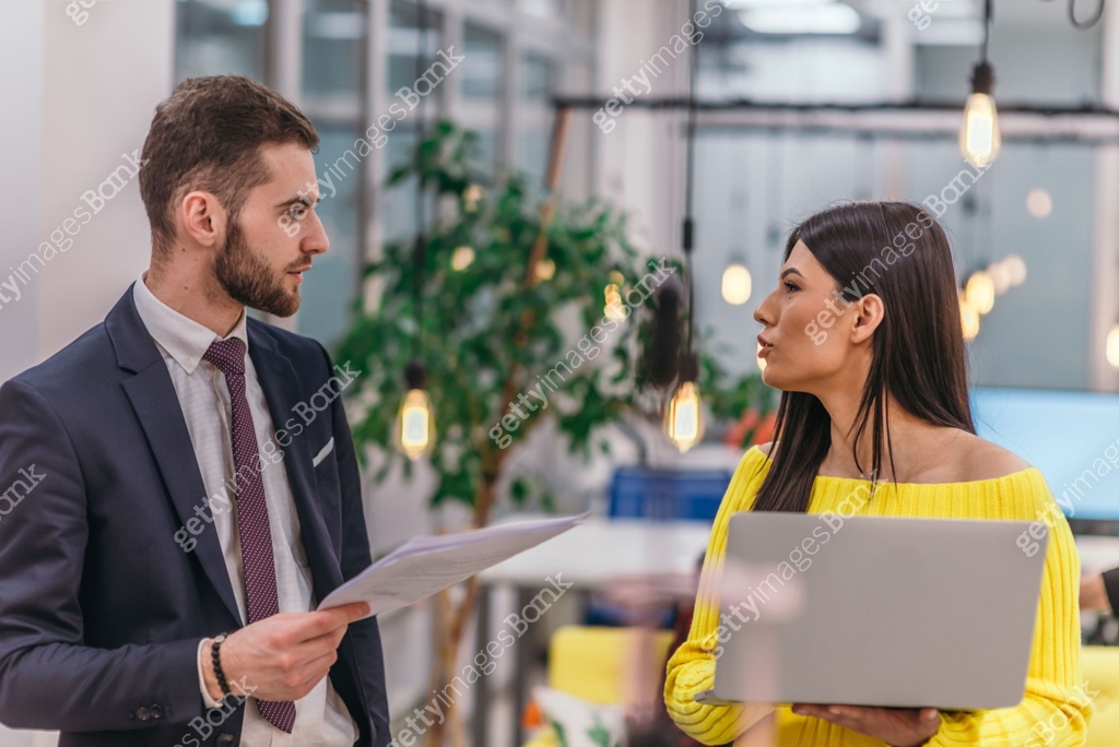 Manager Explaining Task Manager explaining to his employee how to finish her tasks. Colleagues ...