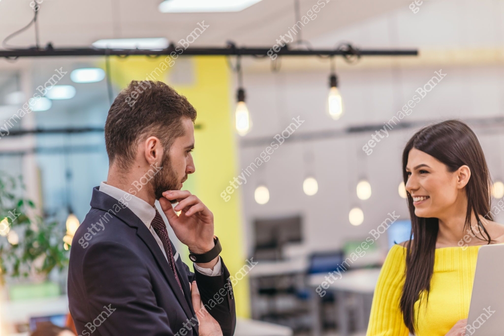 Manager Explaining Task Manager explaining to his employee how to finish her tasks. Colleagues ...