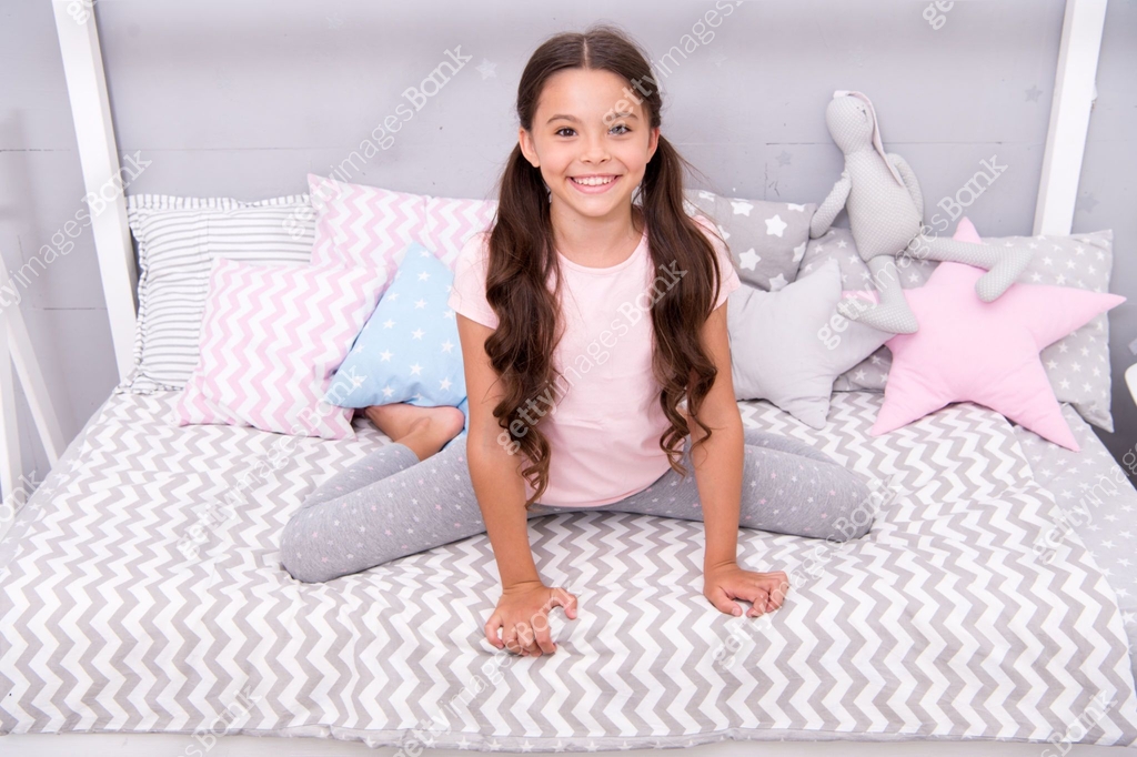 Pediatric care. Happy kid sit on bed. Little baby with healthy smile ...