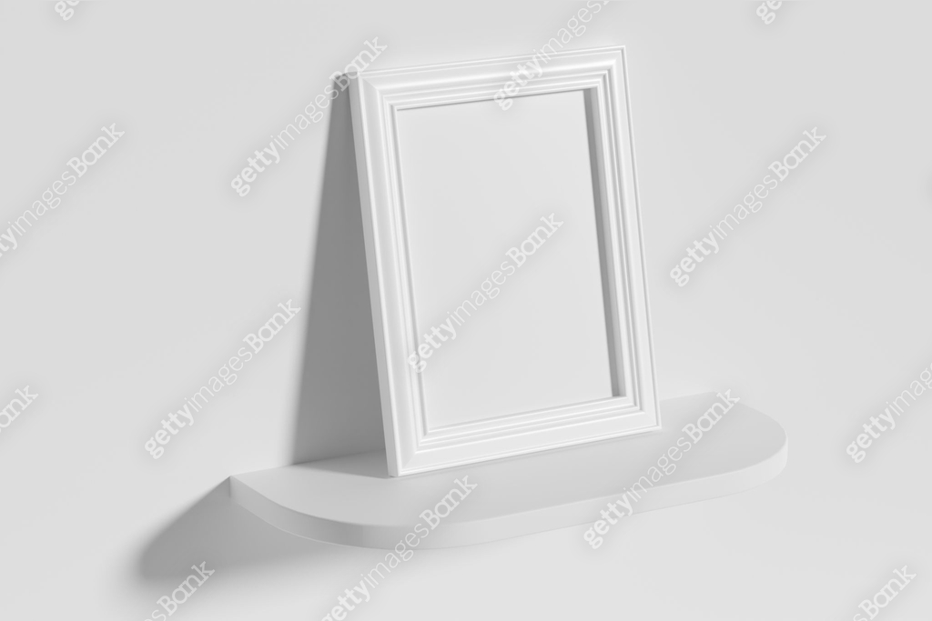 Rectangular photo frame on white rounded shelf leaning at wall top ...