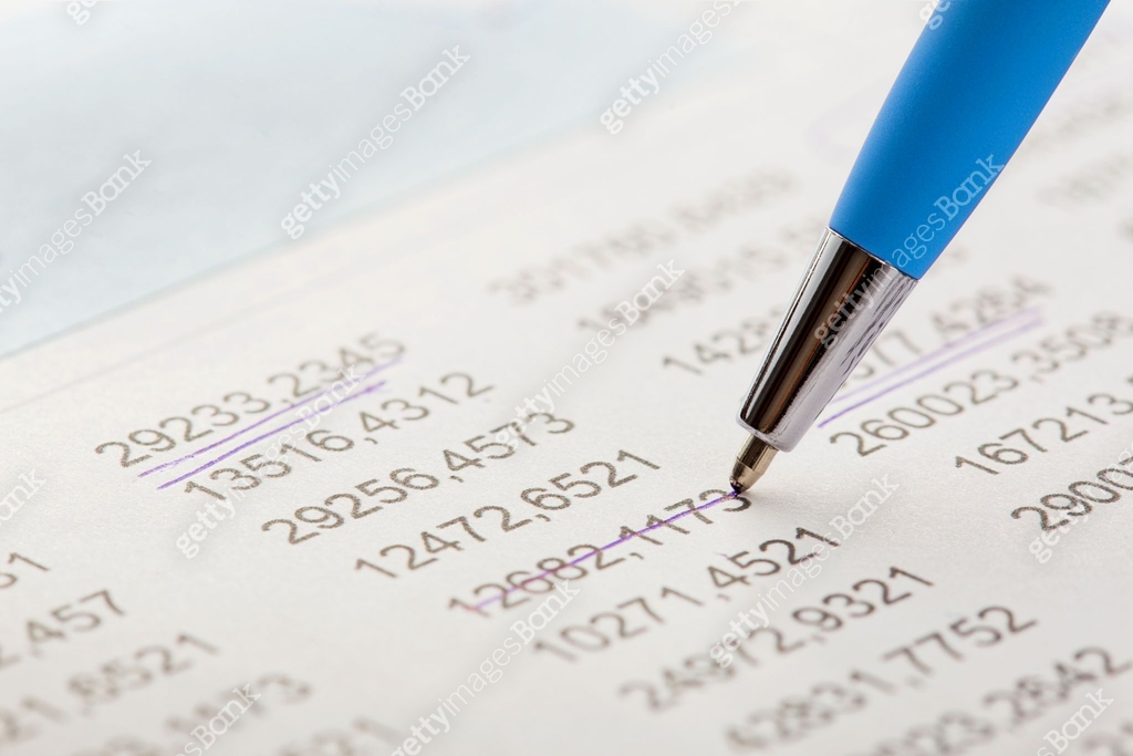 Accounting document with pen,color diagram and checking financial chart ...