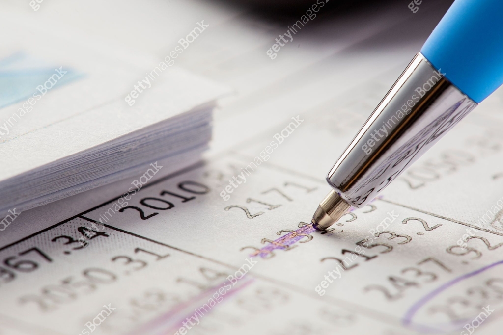 Accounting document with pen,color diagram and checking financial chart ...