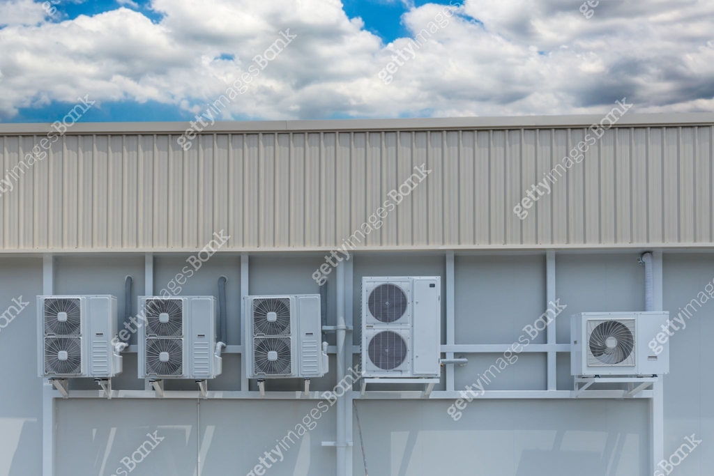 Air conditioner compressor installed in old building. Outdoor split ...