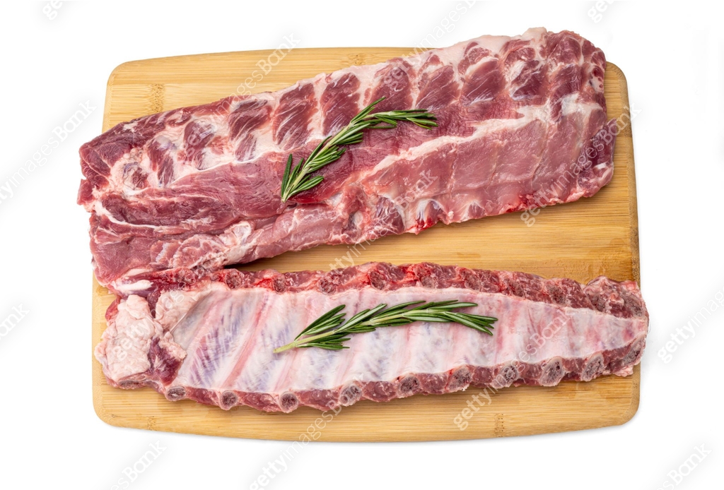 raw pork ribs with spices on cutting board. fresh pork ribs with ...