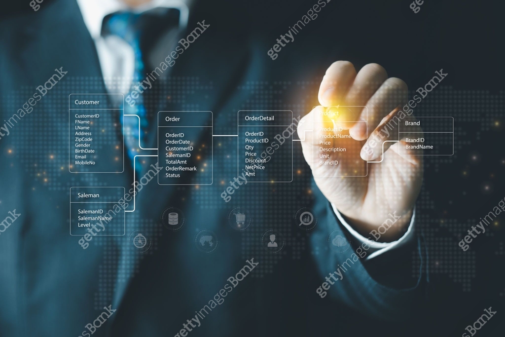 System analyst or businessman drawing relational database tables ...