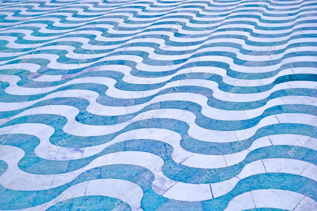New modern paving made with stone wave-shaped in a italian pedestrian ...