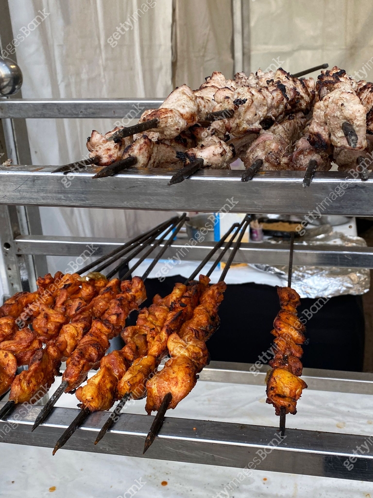 Image of food stall shelving rack display of chicken kebabs, chicken ...