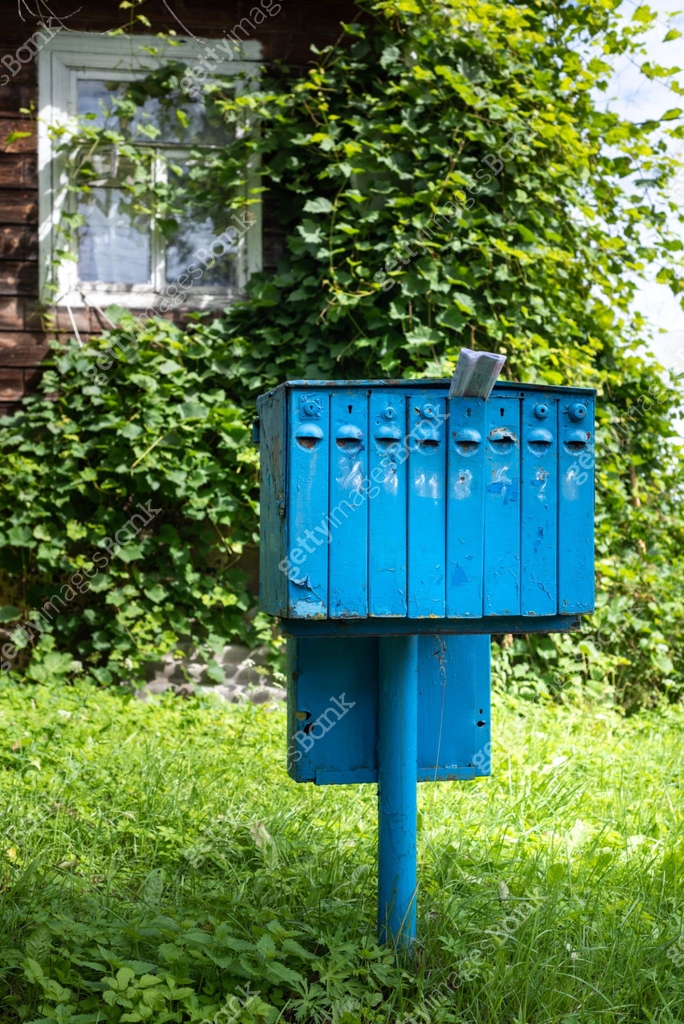 Nearest Blue Mailbox An old blue iron mailbox for mail and correspondence in a village near ...