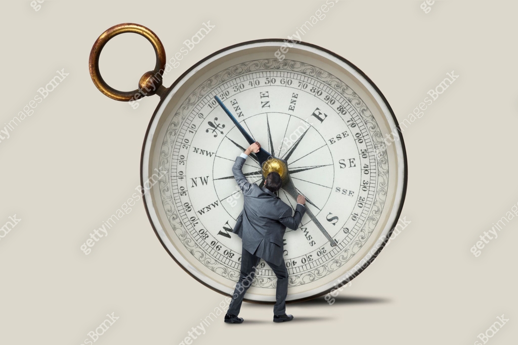 Compass Adjusting Direction Man Adjusting Directional Arrow On A Compass 이미지 (1421401736) - 게티이미지뱅크