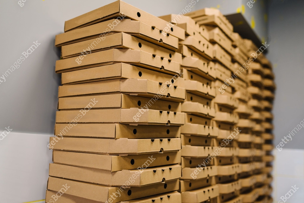 Stack of pizza boxes. Cardboard brown boxes for shipping and delivery ...