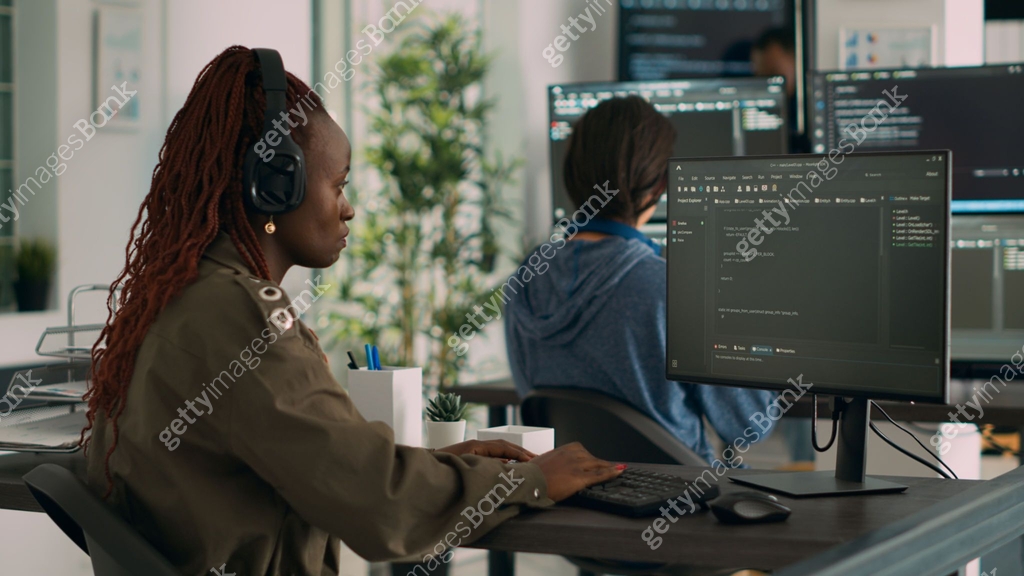 African american software engineer working focused on programming it ...
