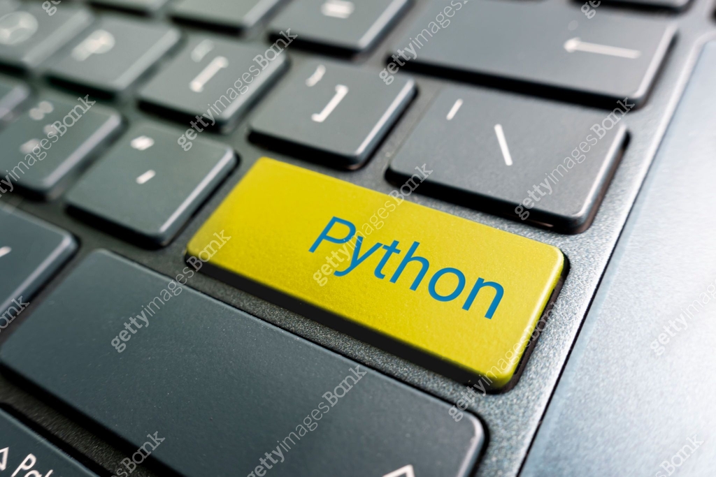 button with the python on the yellow keyboard of modern laptop. 이미지 ...