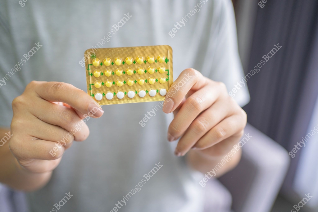 Woman and choosing to use birth control pills Contraceptive methods and ...