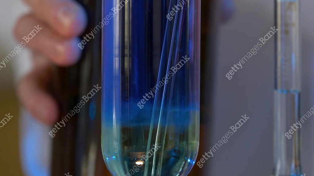Blue Stack Chemical Scientist Pours Blue Pattern Chemicals Into In Flask. health care and ...