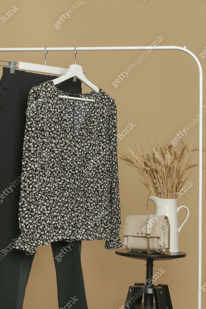 Women's Clothes. Clothes rack with stylish and elegant garments in ...