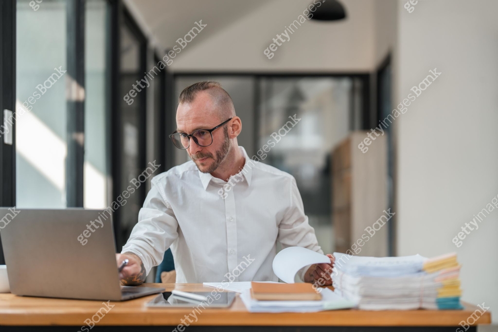Bookkeeper accountant using laptop computer in office, finance and ...