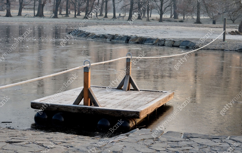 wooden raft is tied to a taut rope. self-service ferry across the river ...