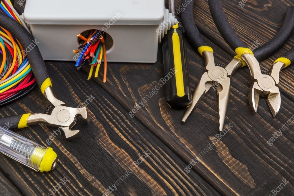 Electrical junction box with cables wire and tools used in the electric ...