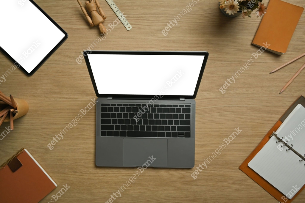 Computer Above View Above view of laptop computer, digital tablet surrounded by stationery ...