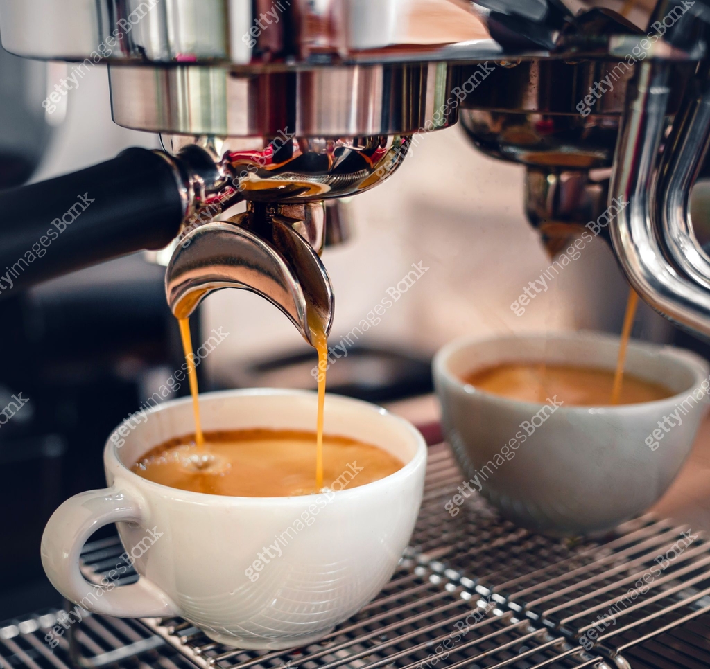 Espresso coffee extraction from a professional coffee machine with a ...