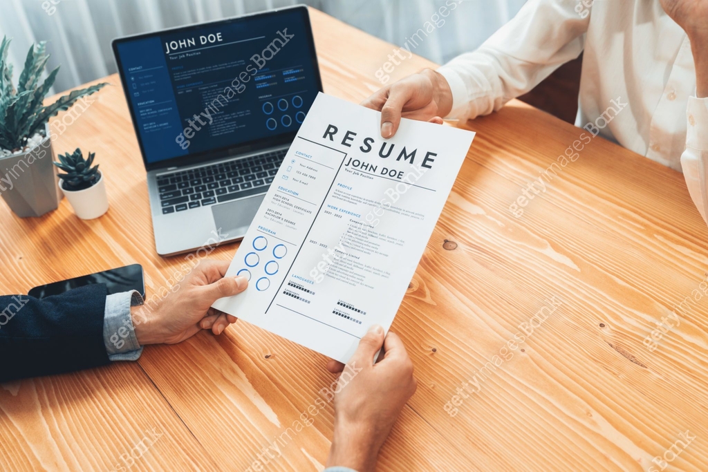 Candidate handing resume or CV over table to interviewer. Entity ์ด๋ฏธ์ง ...
