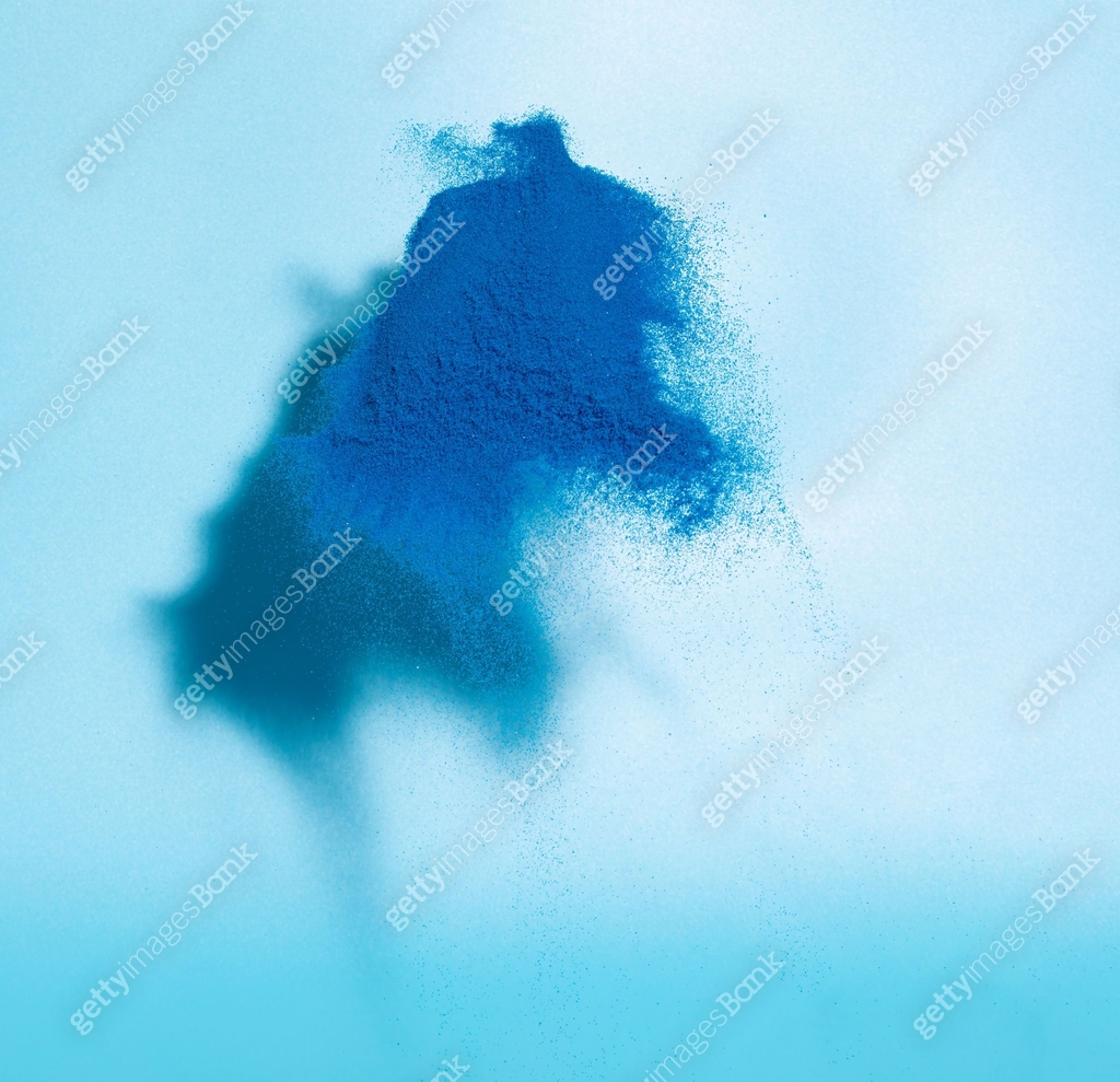 Blue Sand flying explosion, shadow on wall grain wave explode. Abstract ...