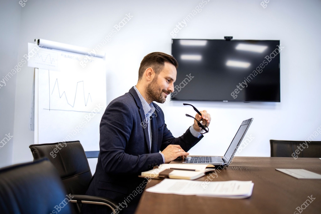 Ceo On Computer CEO in business suit sitting in the office and working on the computer ...