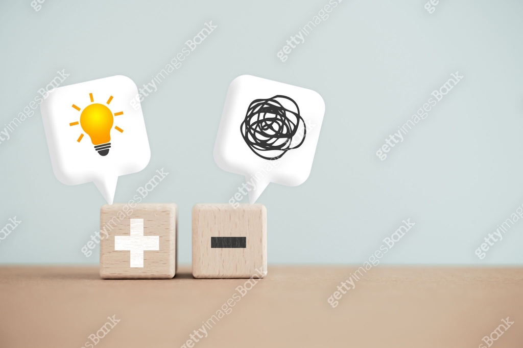 Two wooden cube blocks with plus and minus, a tangle of thoughts and ...