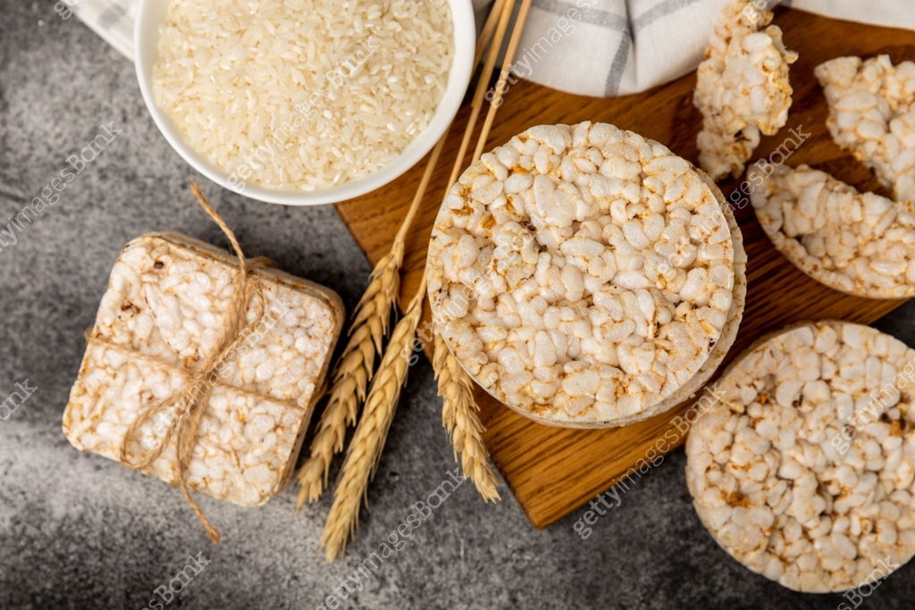 Puff Rice Crispbread Round rice cakes on a wooden table. Crispbread.Puffed rice bread. diet ...