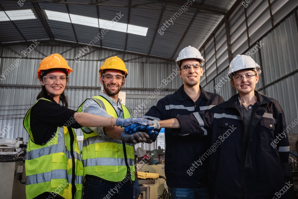 Stack Worker Team engineers and foreman stack hand and shake hands to show success ...