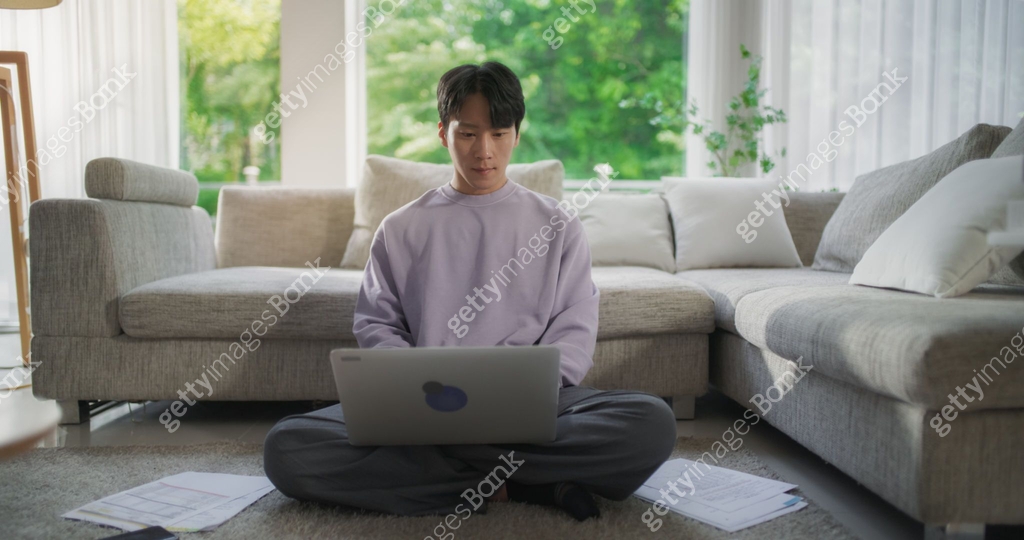 Focused South Korean Professional Enjoying Telecommuting, Working on ...